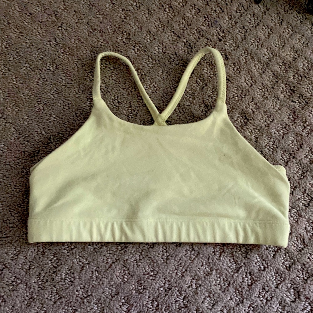 Athlete girl neon light green sports bra